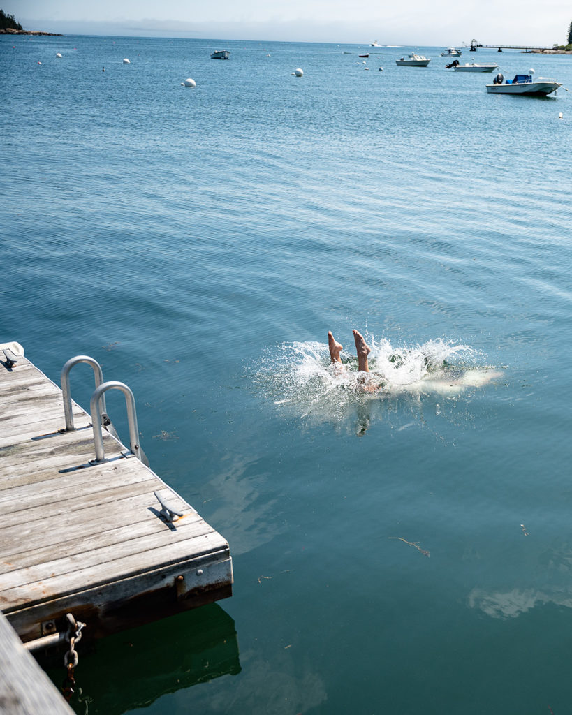 A refreshing dive off the dock into Tenants Harbor, Maine.